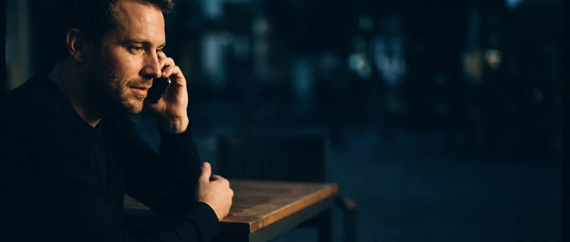 A man on the phone, listening